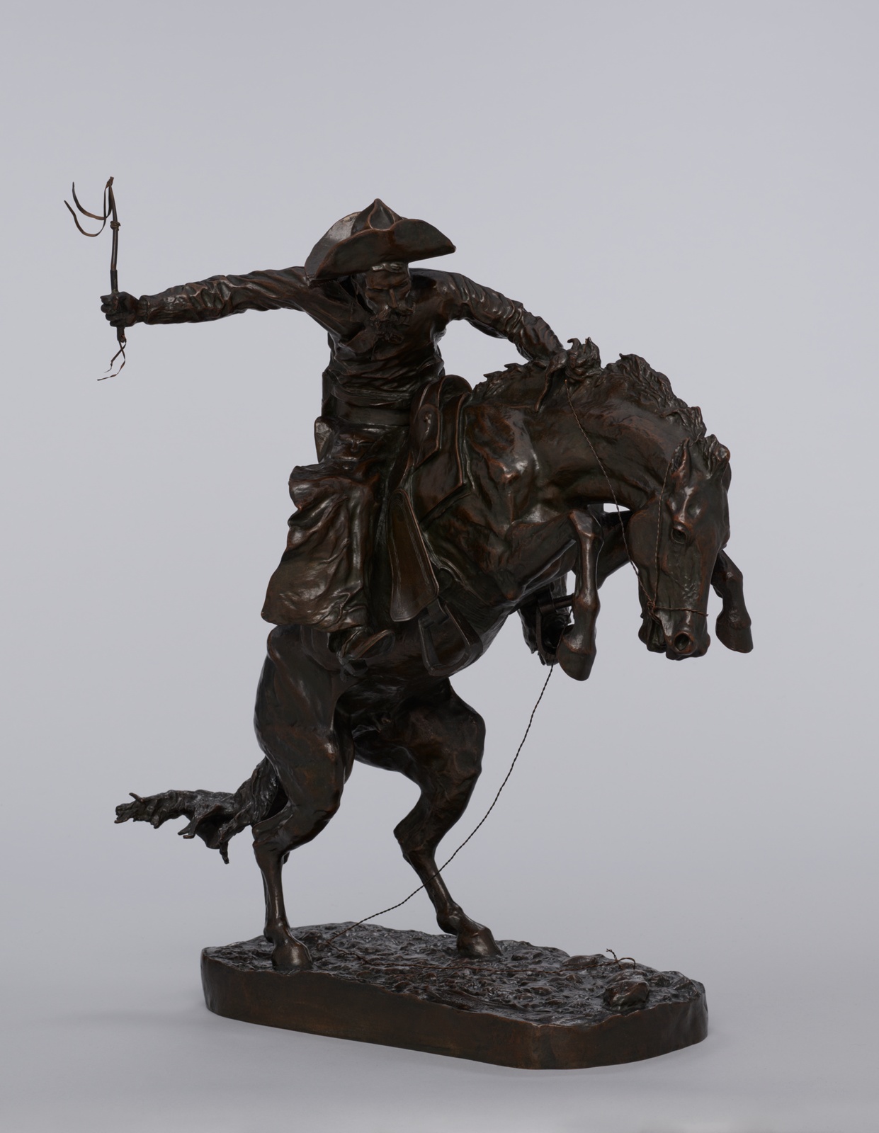 The Bronco Buster by Frederic Remington